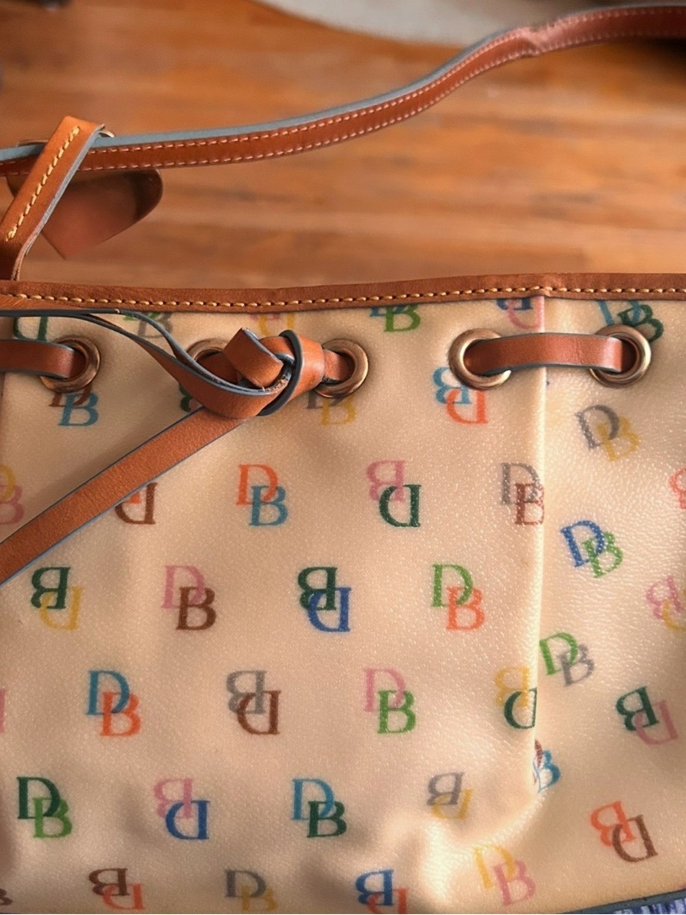 Dooney & Bourke Cream Shoulder Bag with Multicolor DB Logo and Blue Trim